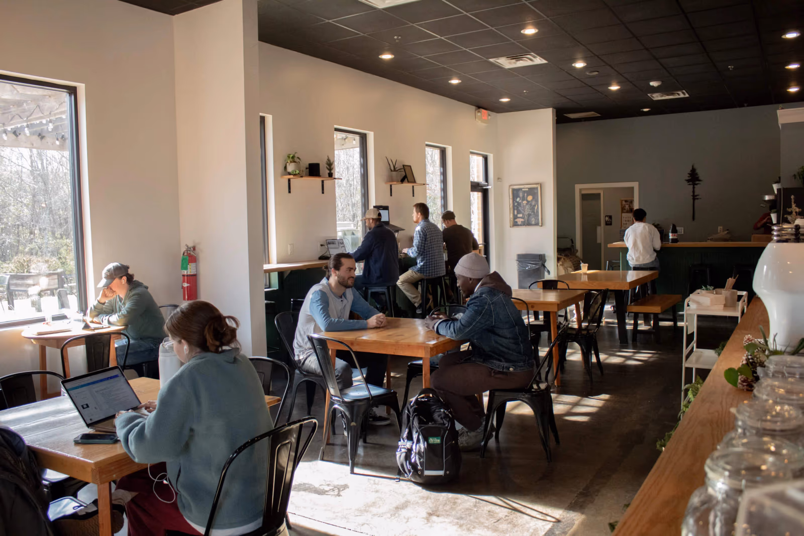 Customers working and chatting inside the Old Pine Coffee Roasters café